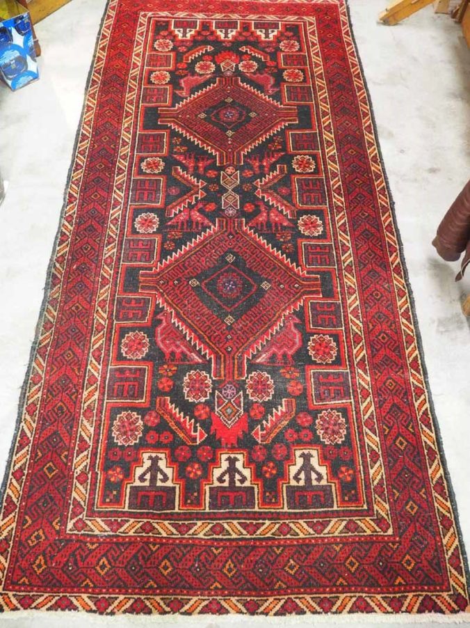 Hand knotted wool on wool Afghan Belouch carpet. Approximatley 60 - 80 years old.