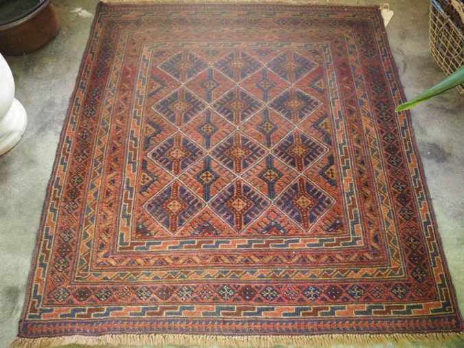 Hand knotted wool on wool Afghani Mushwani carpet.