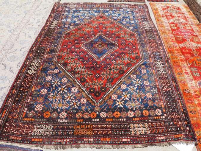 Hand knotted wool on wool carpet from Persia Shiraz, approximately 80 - 100 years old