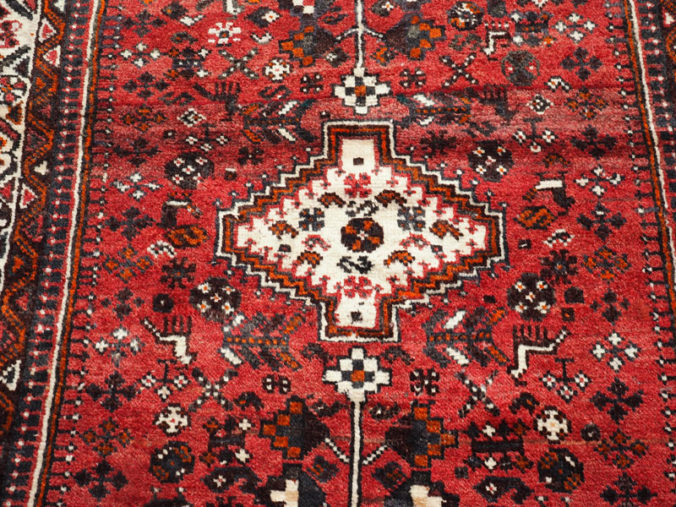 Hand knotted wool on wool Persian carpet from Shiraz, approximately 30 - 40 years old