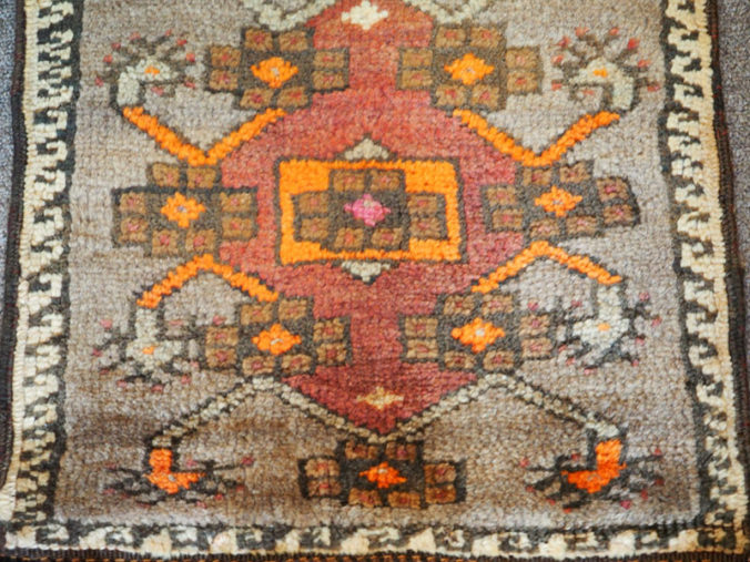 Hand knotted wool on wool Small table mat from Anatolia, approximately 60 years old